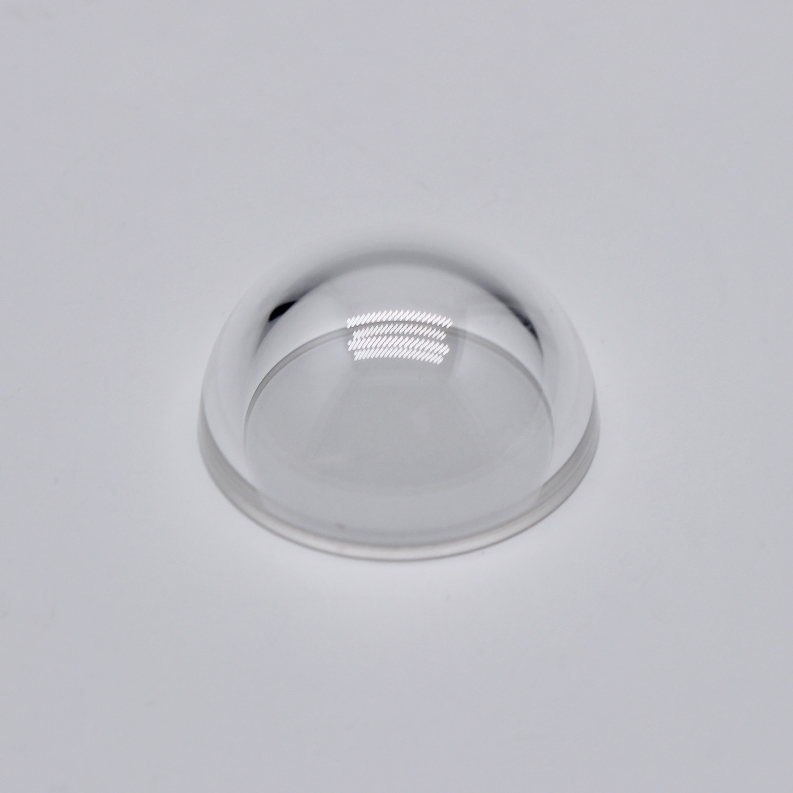 Optical sapphire dome lens with high hardness and infrared transmission for sensor protection
