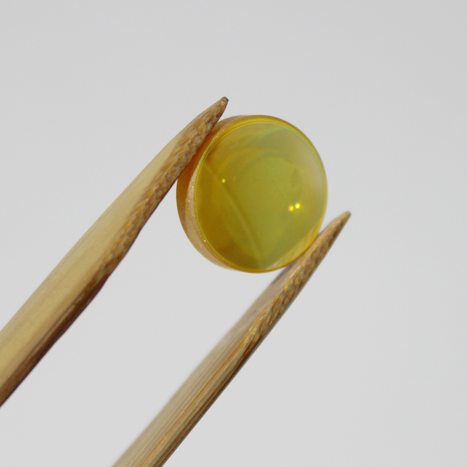High transmission ZnSe lens for CO2 laser beam focusing