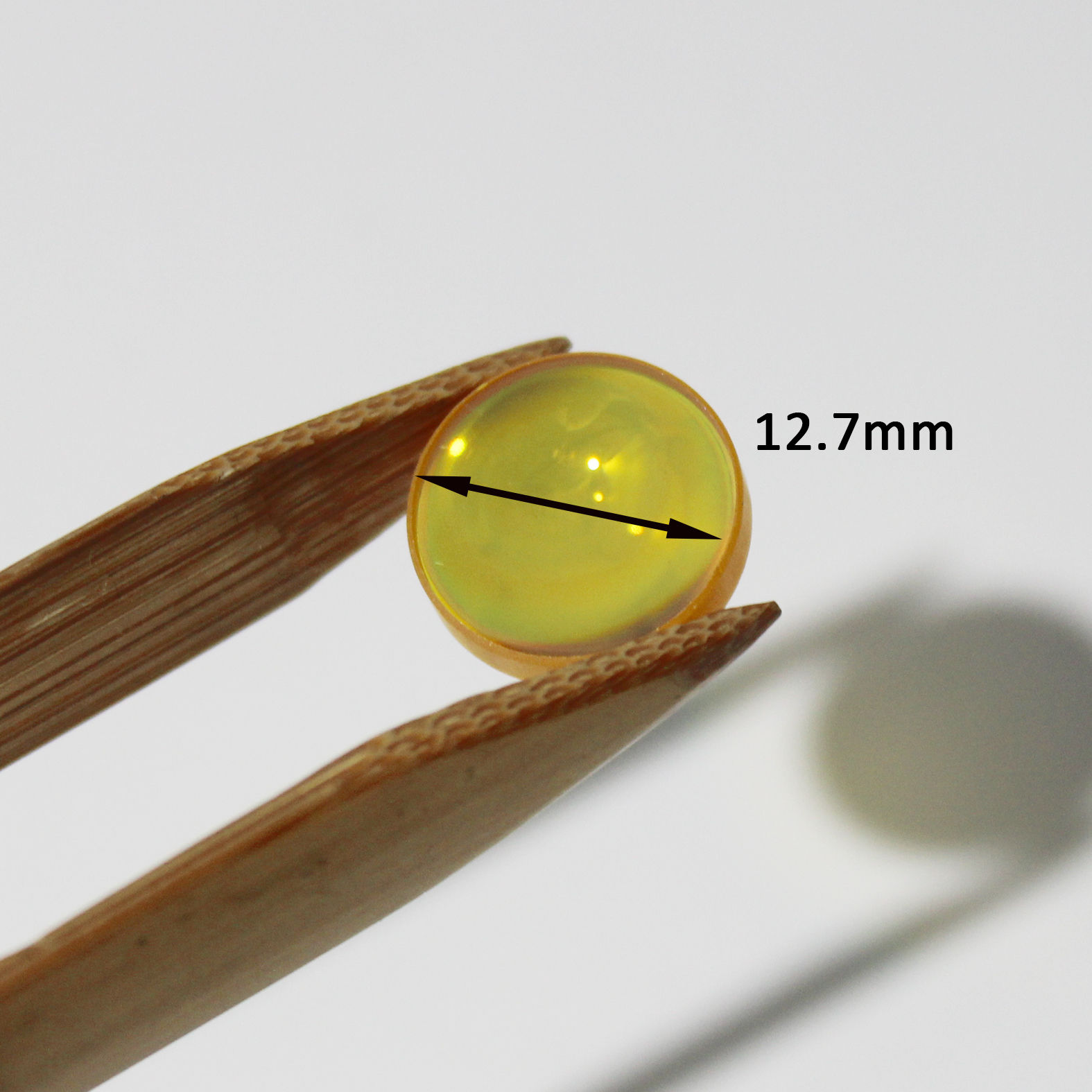 High transmission ZnSe lens for CO2 laser beam focusing