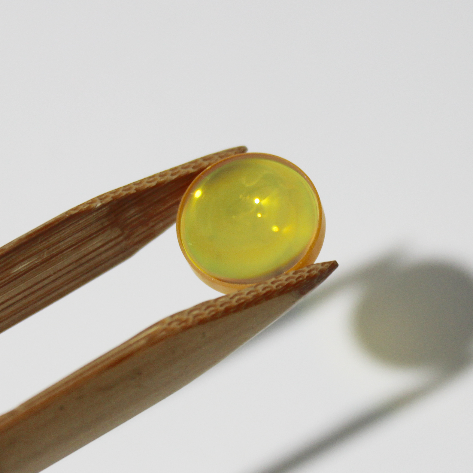 High transmission ZnSe lens for CO2 laser beam focusing