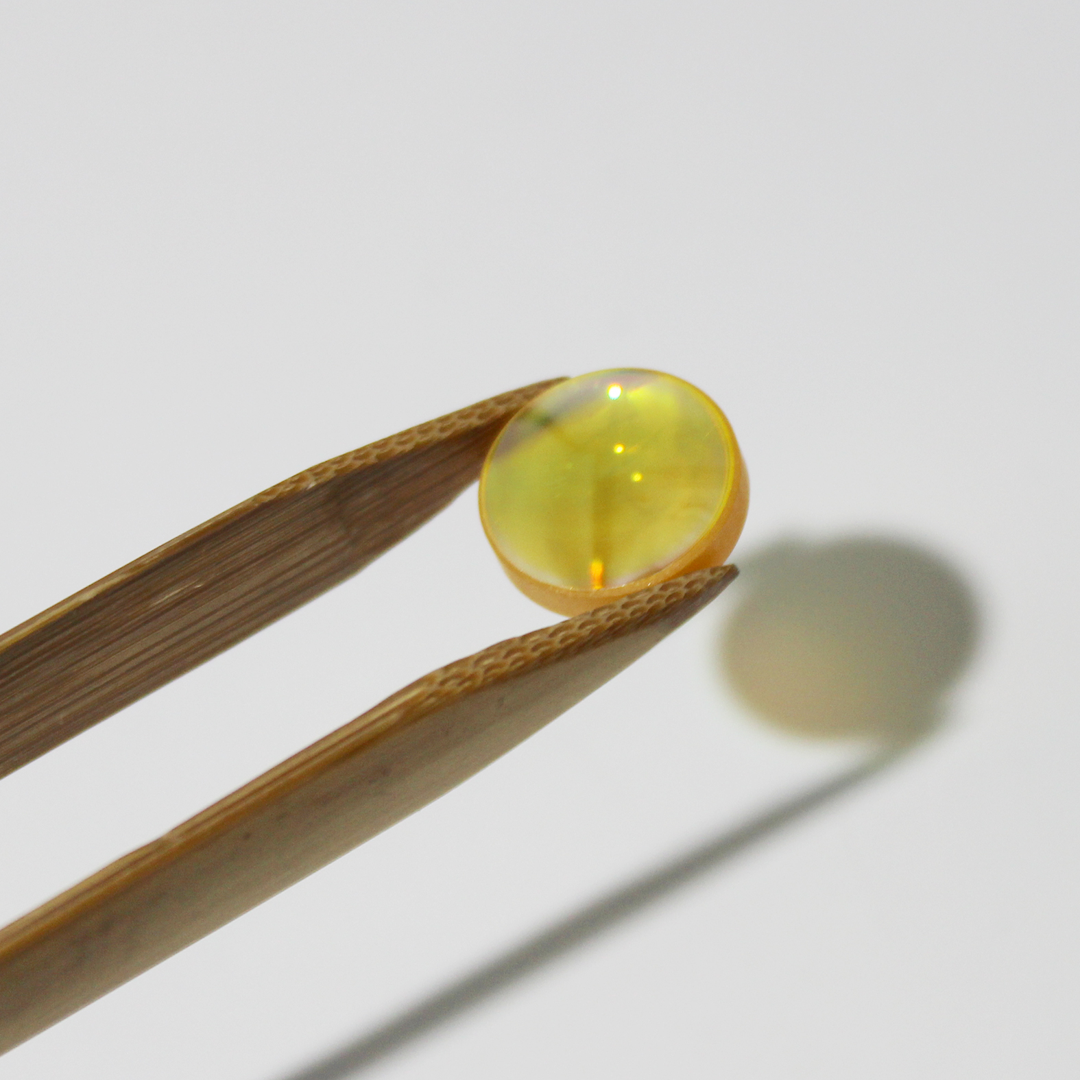 High transmission ZnSe lens for CO2 laser beam focusing