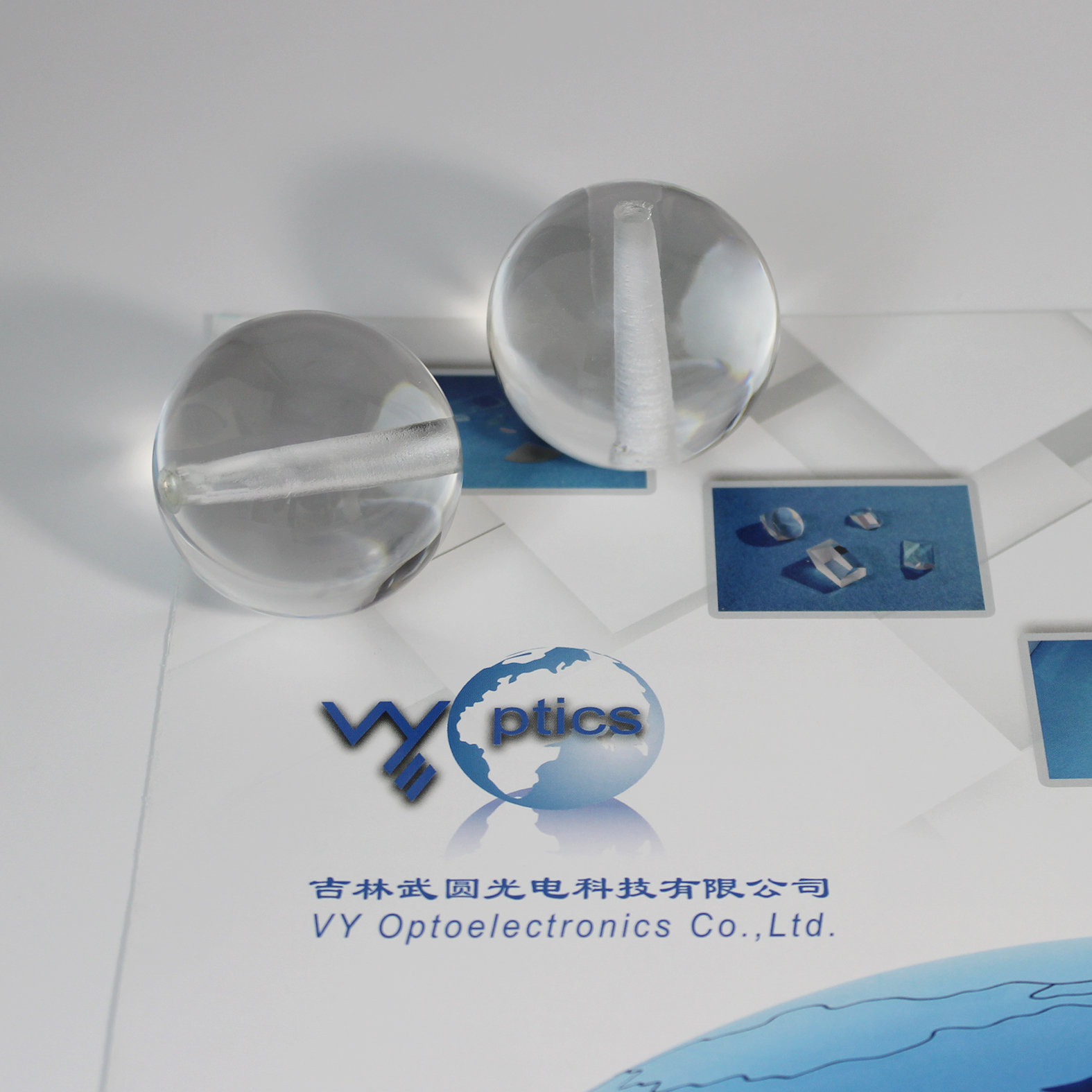 Ball lens with hole for precision optical assembly