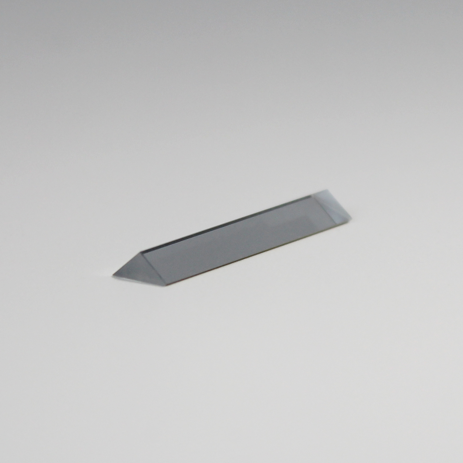 Precision triangular optical prism