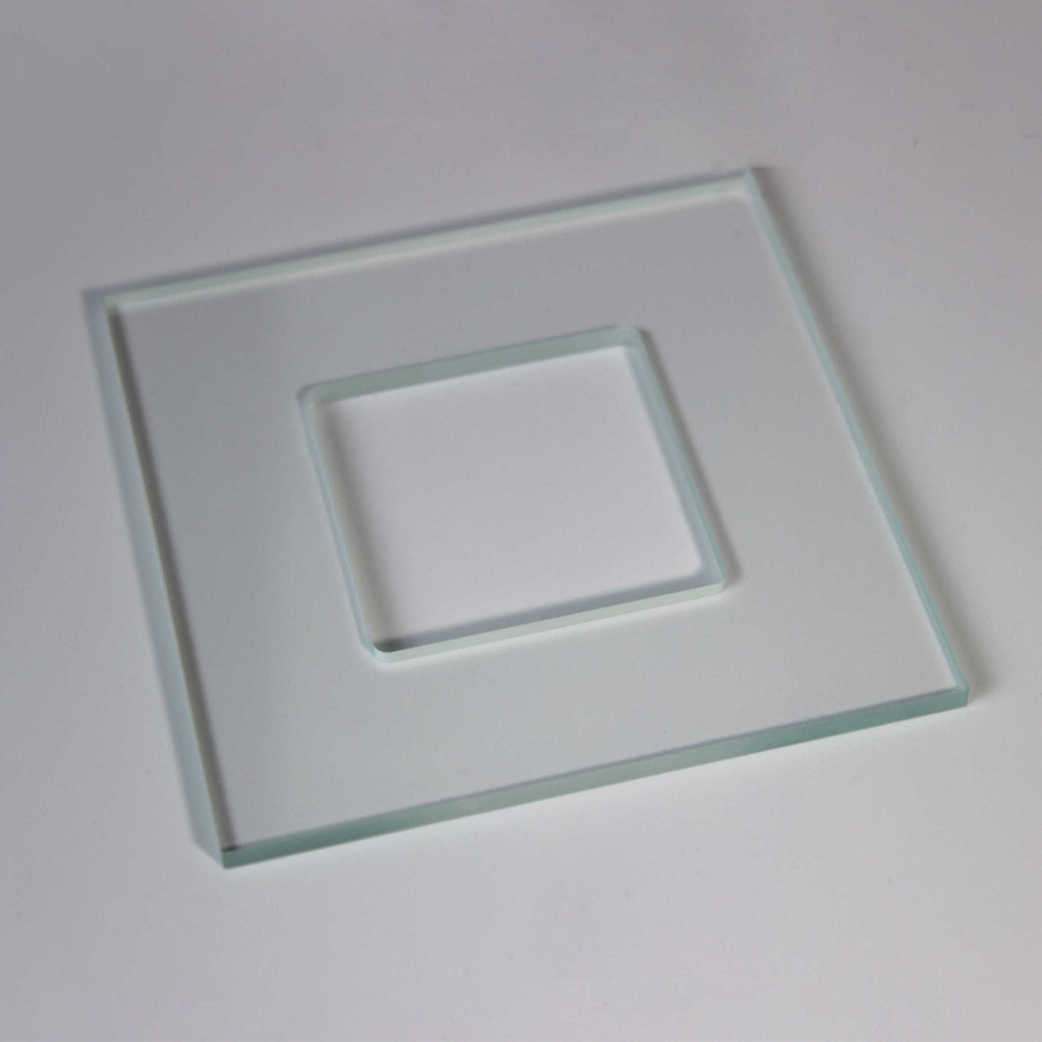 Optical window with hole for precision assembly