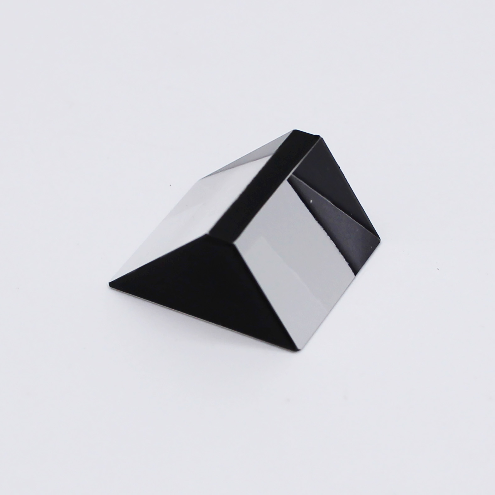 Sapphire optical prism for light reflection and optical system integration