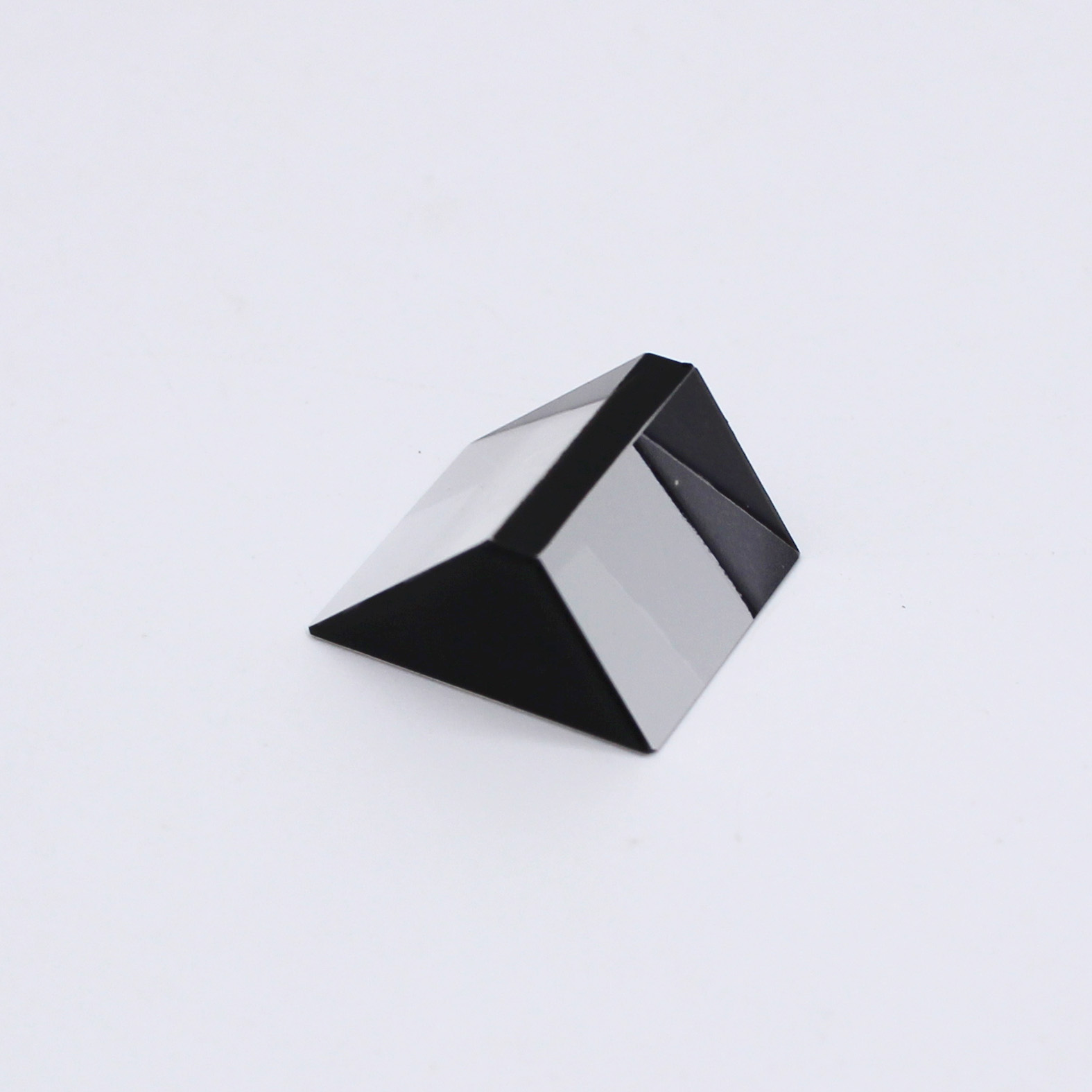 Sapphire optical prism for light reflection and optical system integration