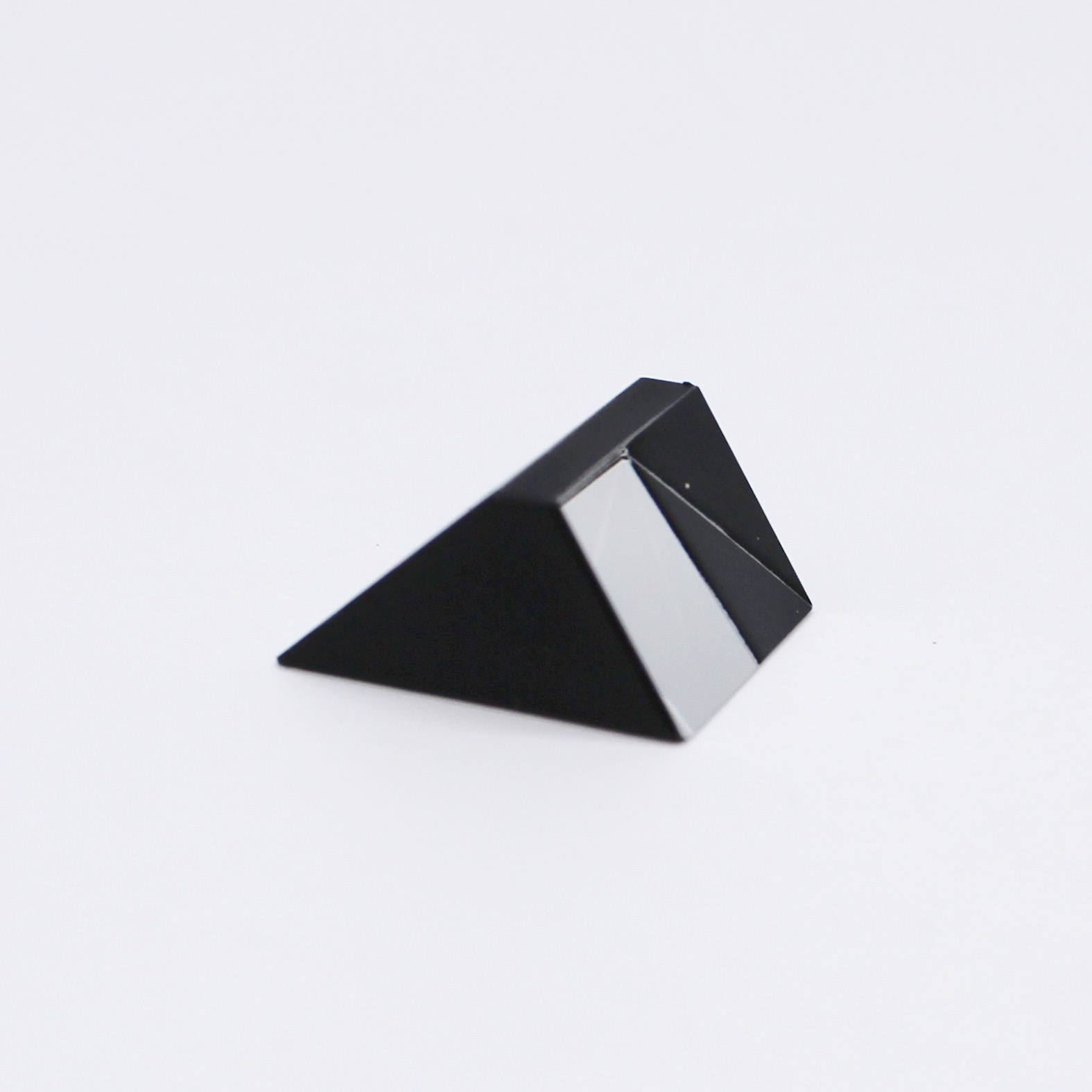 Sapphire optical prism for light reflection and optical system integration