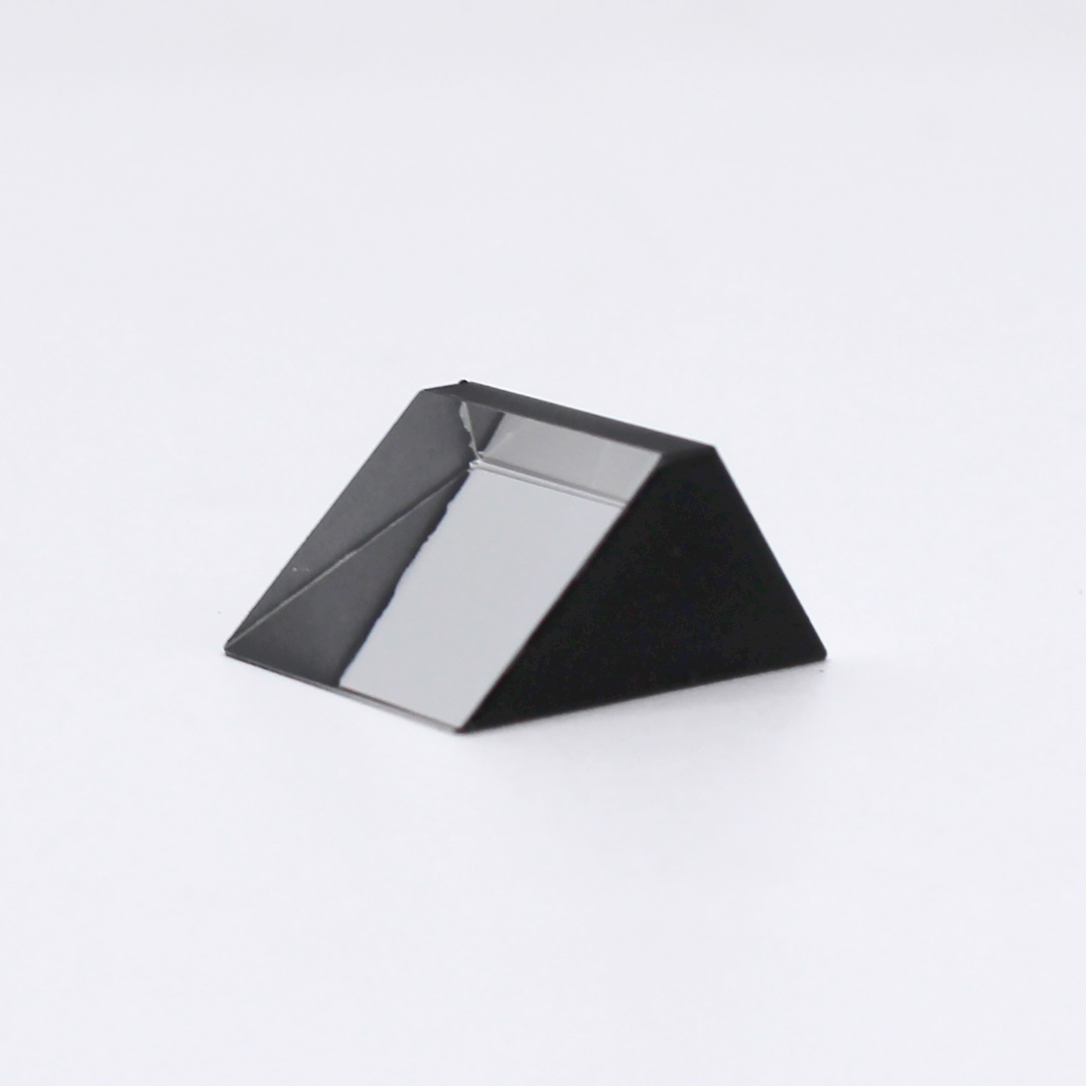 Sapphire optical prism for light reflection and optical system integration